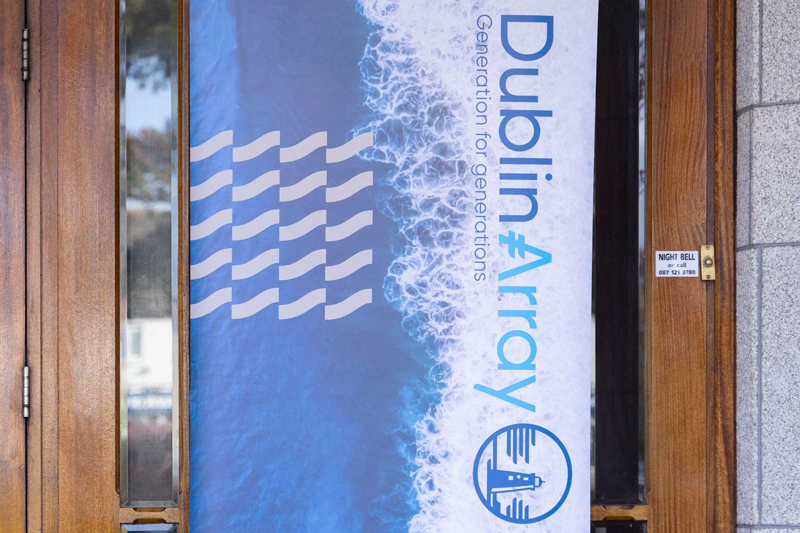 A banner displaying 'Dublin Array' with wavy patterns and a lighthouse logo. The background features blue waves.